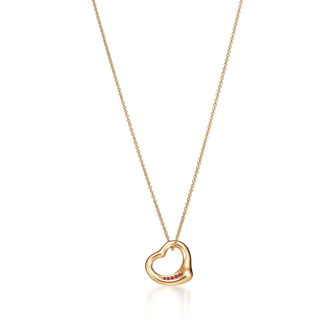 TIFFANY  ELSA PERETTI® OPEN HEART PENDANT IN YELLOW GOLD WITH RUBIES, 16 MM