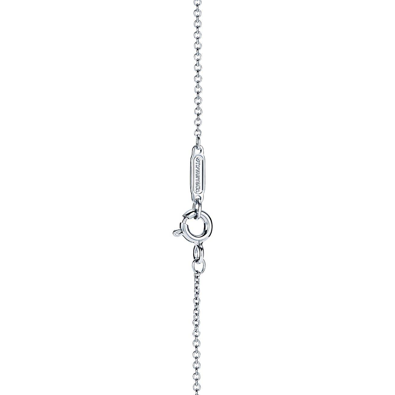 Tiffany T Diamond Pendant in 18k White Gold with a Baguette Diamond